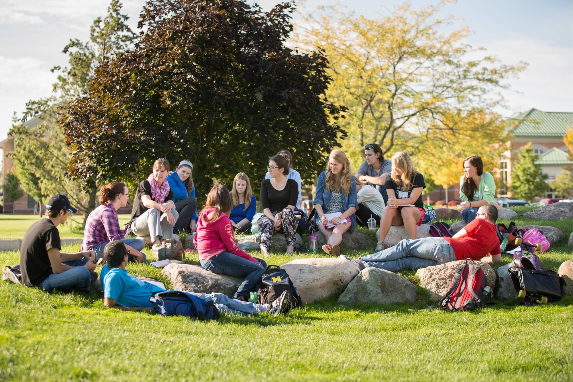 Image of people sitting outside together